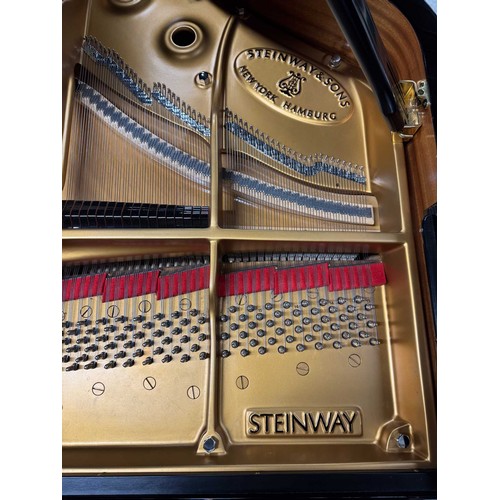 90 - Steinway (c2004)A 9ft Model D concert grand in a bright ebonised case on square tapered legs.