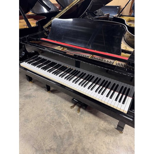 92 - Yamaha (c1975)A 5ft 7in Model G2 grand piano in a bright ebonised case on square tapered legs; toget... 