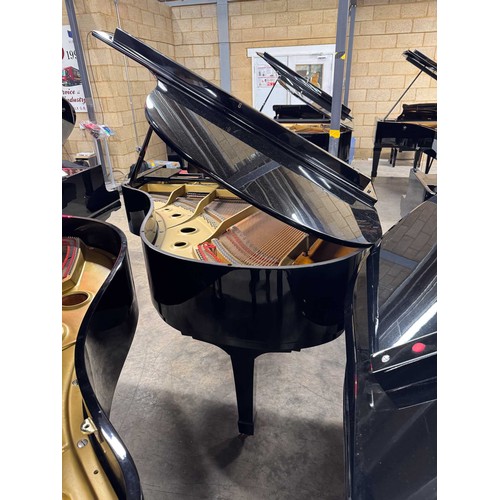 92 - Yamaha (c1975)A 5ft 7in Model G2 grand piano in a bright ebonised case on square tapered legs; toget... 