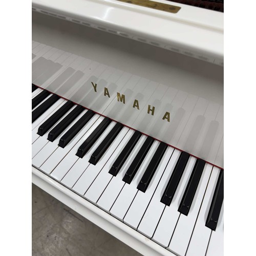 93 - Yamaha (c1988)A 5ft 7in Model G2 grand piano in a bright white case on squarer tapered legs; mounted... 