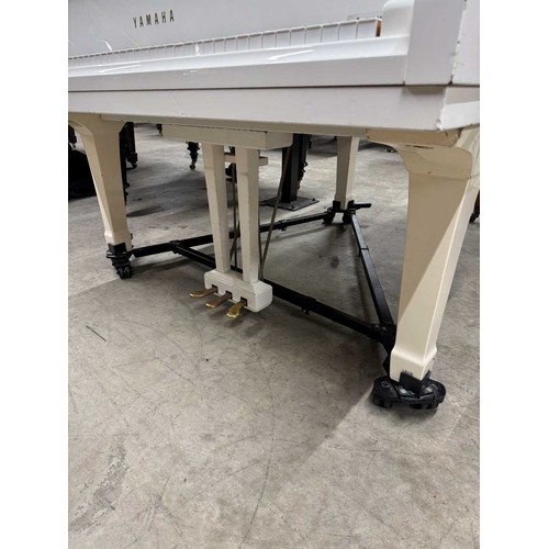 93 - Yamaha (c1988)A 5ft 7in Model G2 grand piano in a bright white case on squarer tapered legs; mounted... 