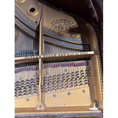 96 - Steinway (c1910)A 5ft 10in Model O grand piano in a rosewood case on square tapered legs; mounted on... 