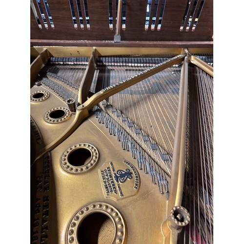 96 - Steinway (c1910)A 5ft 10in Model O grand piano in a rosewood case on square tapered legs; mounted on... 