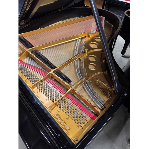 98 - Steinway (c1924)A 5ft 10in Model O grand piano in a bright ebonised case on square tapered legs. Thi... 