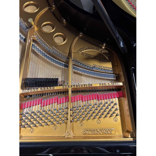 98 - Steinway (c1924)A 5ft 10in Model O grand piano in a bright ebonised case on square tapered legs. Thi... 