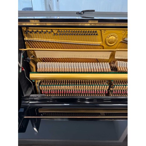 101 - Yamaha (c1975)A Model U1 upright piano in a bright ebonised case; together with a matching adjustabl... 