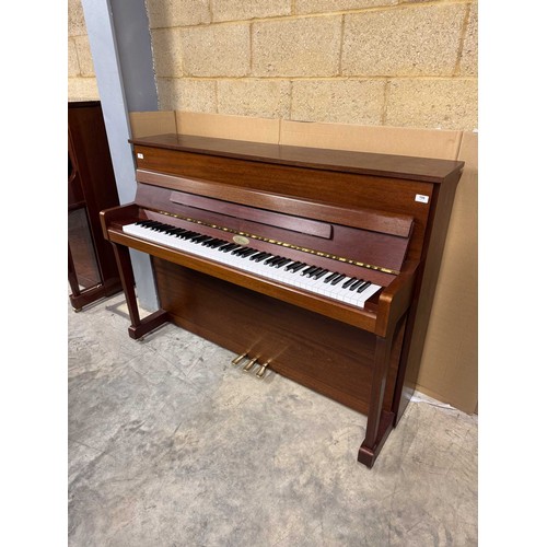 106 - Kemble (c1996)A Model Oxford upright piano in a traditional satin mahogany case.