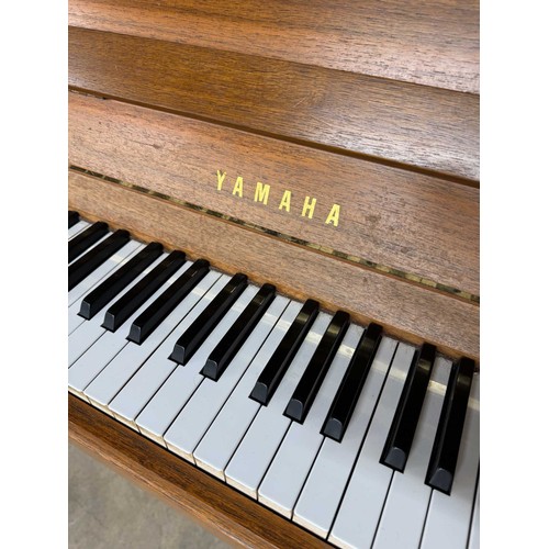 111 - Yamaha (c1979)A Model M5J upright piano in a modern style teak case.