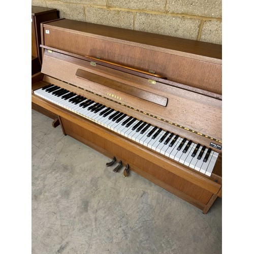 111 - Yamaha (c1979)A Model M5J upright piano in a modern style teak case.