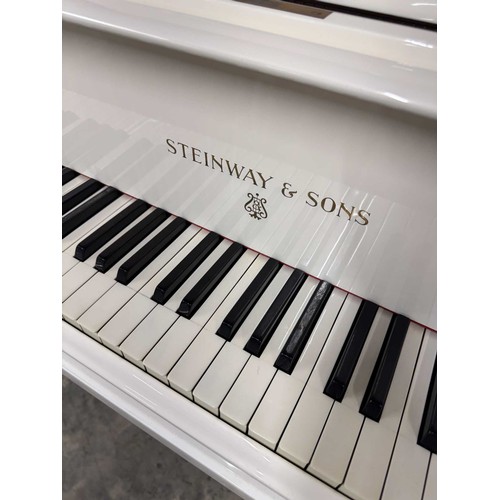 113 - Steinway (c1928)A 5ft 7in Model M grand piano in a bright white case on square tapered legs; togethe... 