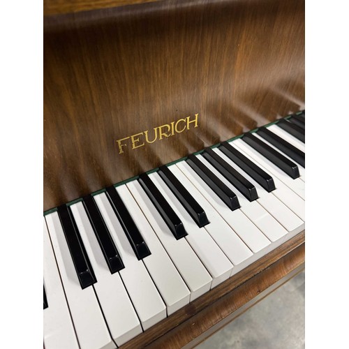 123 - Feurich (c1975)A 5ft 6in grand piano in a walnut case on cabriole legs; together with a stool.