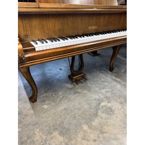 123 - Feurich (c1975)A 5ft 6in grand piano in a walnut case on cabriole legs; together with a stool.