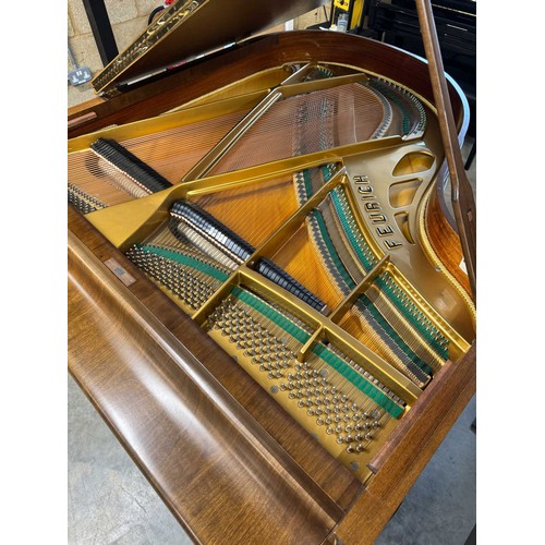 123 - Feurich (c1975)A 5ft 6in grand piano in a walnut case on cabriole legs; together with a stool.