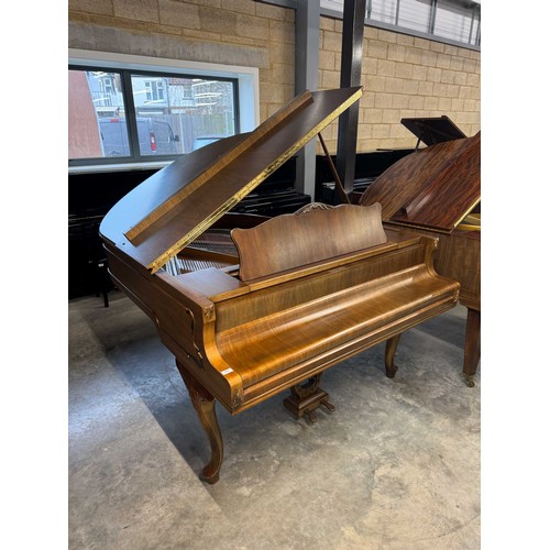 123 - Feurich (c1975)A 5ft 6in grand piano in a walnut case on cabriole legs; together with a stool.