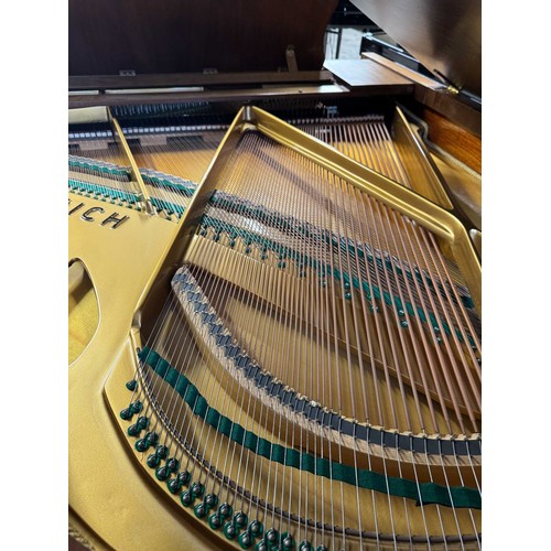 123 - Feurich (c1975)A 5ft 6in grand piano in a walnut case on cabriole legs; together with a stool.