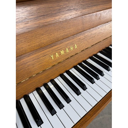 11 - Yamaha (c1984)A Model M5J upright piano in a teak case.