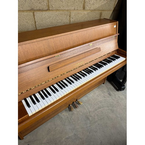 11 - Yamaha (c1984)A Model M5J upright piano in a teak case.