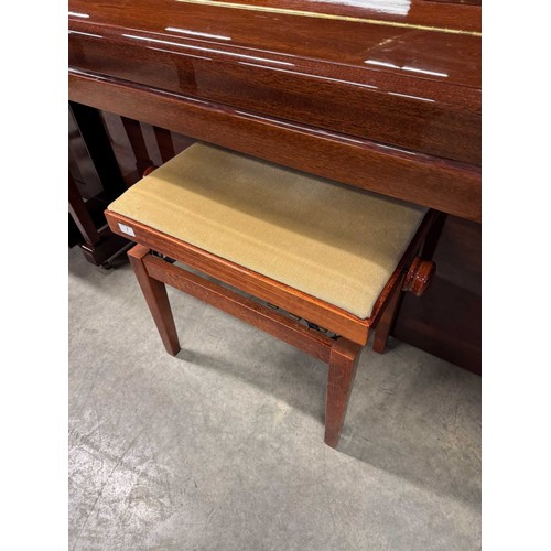 7 - Kemble (c1999)An upright piano in a traditional bright ebonised case; together with a stool. AMENDME... 