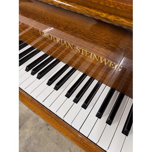 79 - Grotrian Steinweg (c1985)A 6ft 2in Model 189 grand piano in a walnut case on square tapered legs; to... 