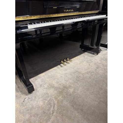 81 - Yamaha (c1994)A Model U100 upright piano in a bright ebonised case; together with a matching stool.... 