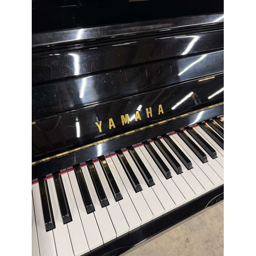 81 - Yamaha (c1994)A Model U100 upright piano in a bright ebonised case; together with a matching stool.... 