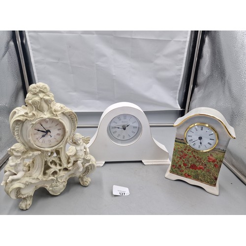 127 - Set OF 3 Clocks to include A Paris Mantle Clock, A Cherub Clock and A Lest We Forget Poppy Charity C... 