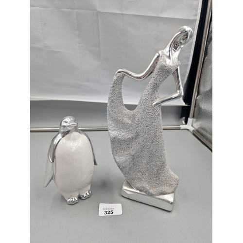 325 - Silver Penguin and a Silver Lady.