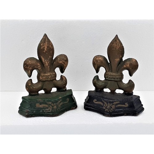 918 - 2 x Cast Metal Fleur De Lys Door Stops