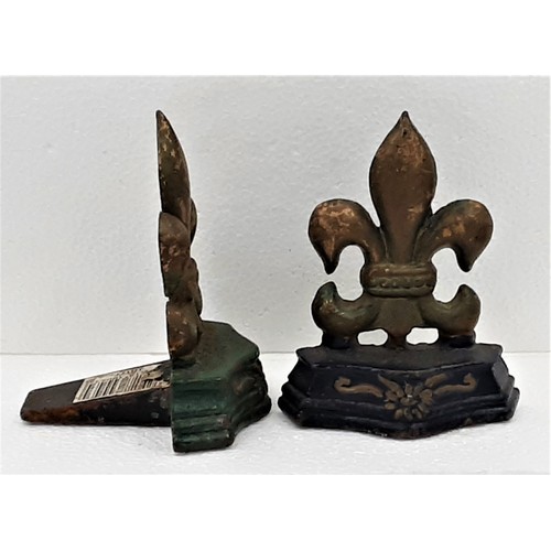 918 - 2 x Cast Metal Fleur De Lys Door Stops