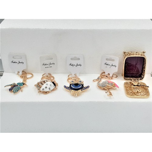 920 - Gilt Trinket Box & 4 Bling Keyrings