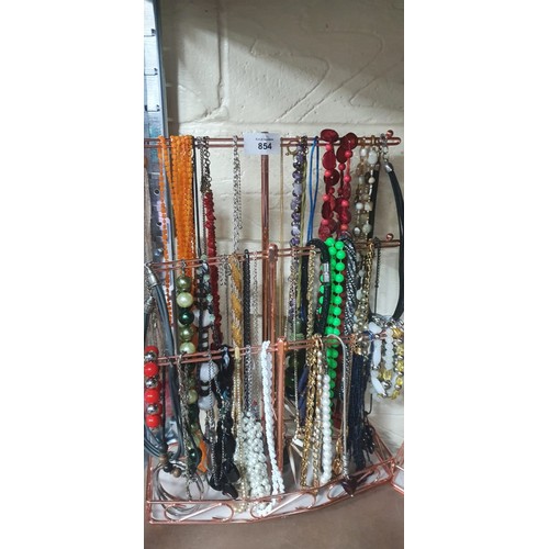 854 - Stand of Fashion/Vintage Jewelry To Include Necklaces and Bracelets. (stand not included)