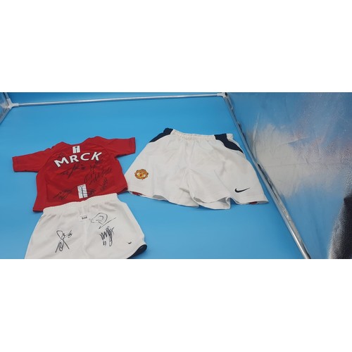 938 - MUFC Shorts and Top Signed and MUFC Shorts Unsigned.