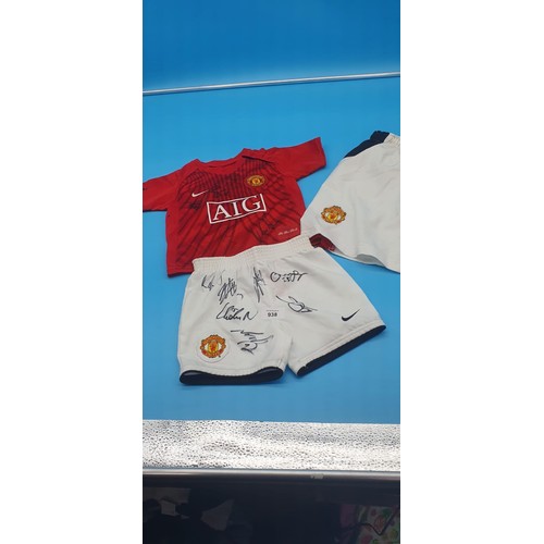 938 - MUFC Shorts and Top Signed and MUFC Shorts Unsigned.