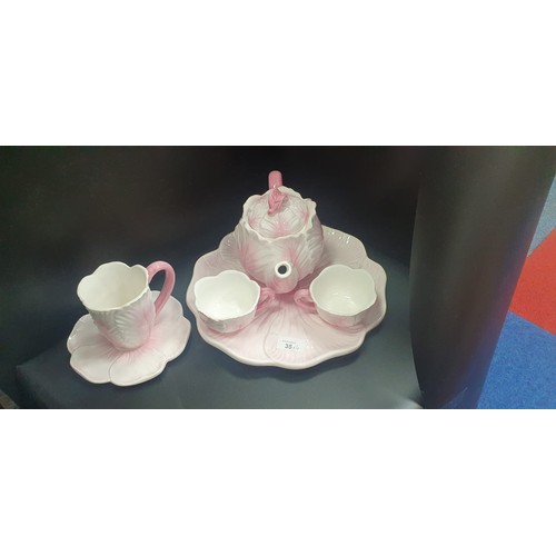 35 - Pink Teapot, Mug, 2 Cups, Saucer and a Cake Plate.