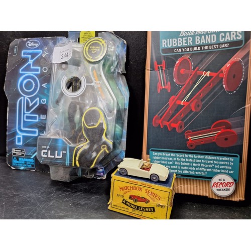 344 - Vintage Boxed Matchbox Car, Disney Tron and A Rubber Band Car