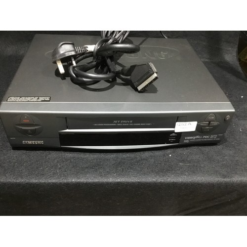 1252A - Group of VHS Tapes and VHS player m/c