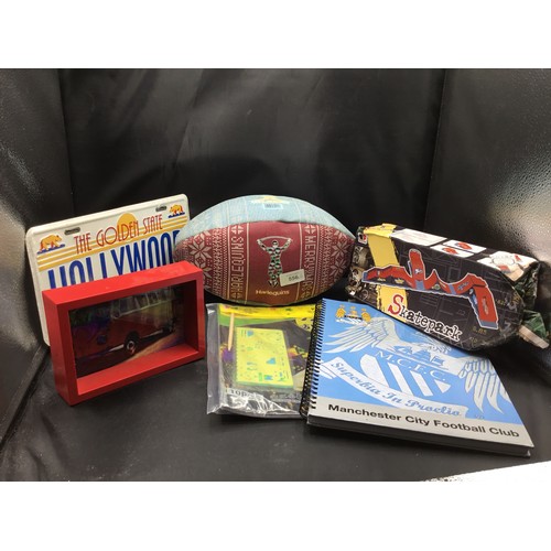 556 - Mixed Lot To Include Harlequin Rugby Ball, Stencil Set, Skate Park, MCFC Notebook, VW Picture Etc.