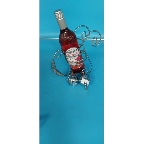 380 - Wine Bottle Holder, 2 Wine Pourers and a Bottle Of Wine