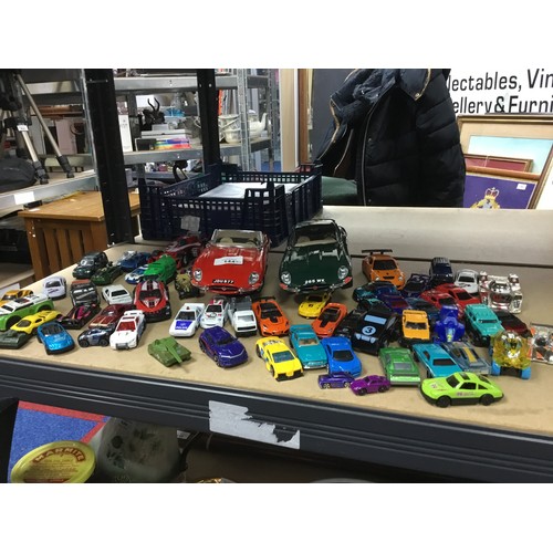 144 - Box of Various Cars To Include Hot Wheels x10, 30 Disney Pixar Cars and 2 Burago Jaguar Cars On Stan... 