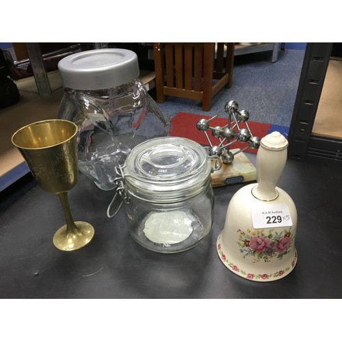 229 - Large Glass Biscuit Jar, Small Biscuit Jar, Ceramic Bell, Goblet and an Atomium Figure