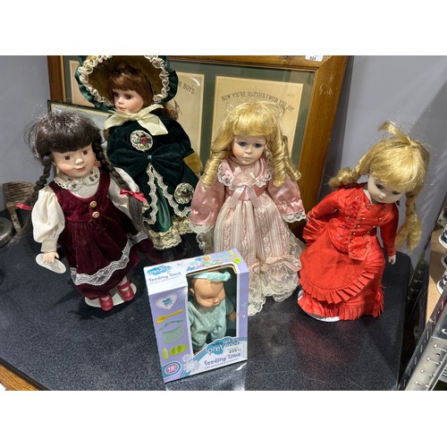 225 - Four Dolls and a Boxed Baby Doll