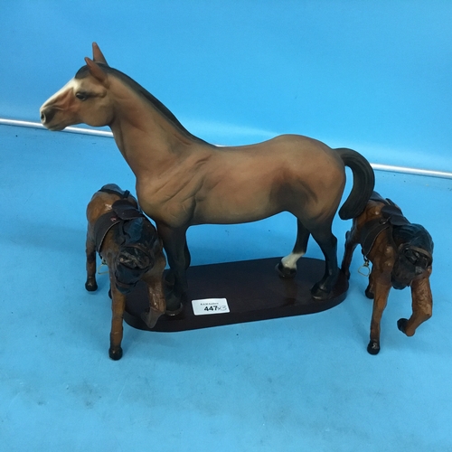 447 - Ceramic horse on plynth +2 leather horses