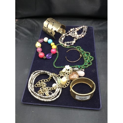 1242 - Pad Of Bracelets, Bangles and Necklaces