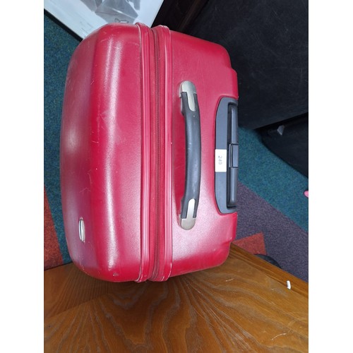 249 - Large Burgundy Suitcase On Wheels