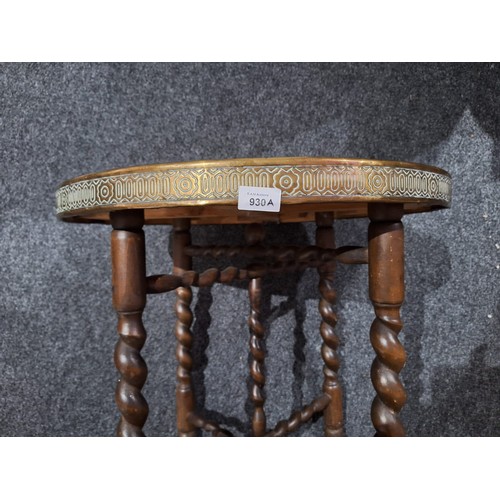 930A - Barley Twist Stretched Leg Table With a Brass Covered Top Lion to the Centre