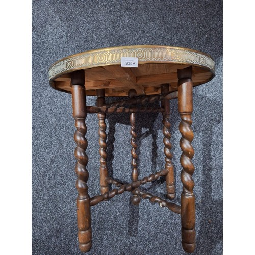 930A - Barley Twist Stretched Leg Table With a Brass Covered Top Lion to the Centre