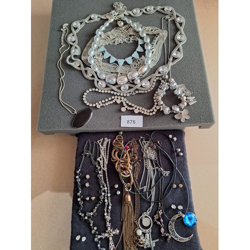 876 - Two Pads Of Fashion and Vintage Jewellery To Include Earrings, Necklaces and Bracelets