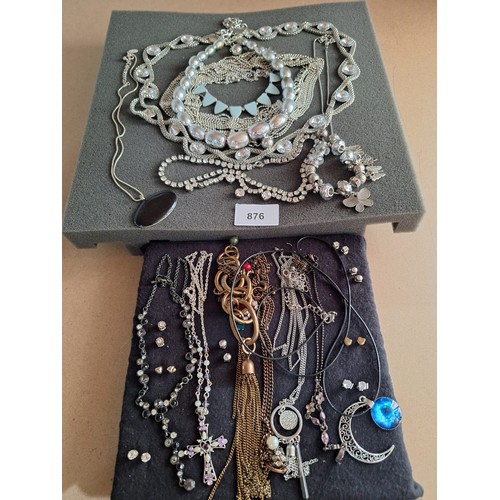 876 - Two Pads Of Fashion and Vintage Jewellery To Include Earrings, Necklaces and Bracelets