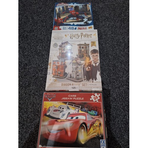 125 - Puzzles x3 To Include Sealed Harry Potter, Spiderman and Cars