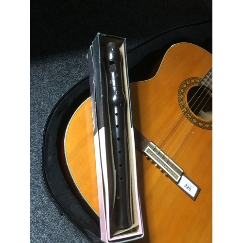 320 - Guitar in a Case and a Vintage Flute